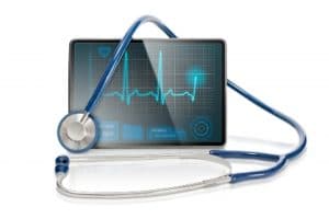 picture of stethoscope and digital tablet showing heartbeat
