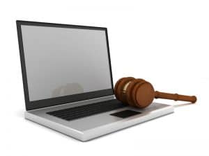 photo of laptop with gavel